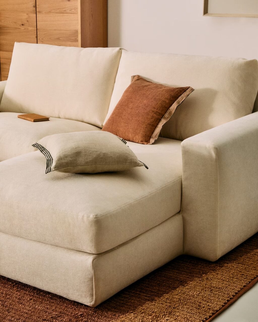 A close up of the beige Alea sofa, showing the chaise longue.